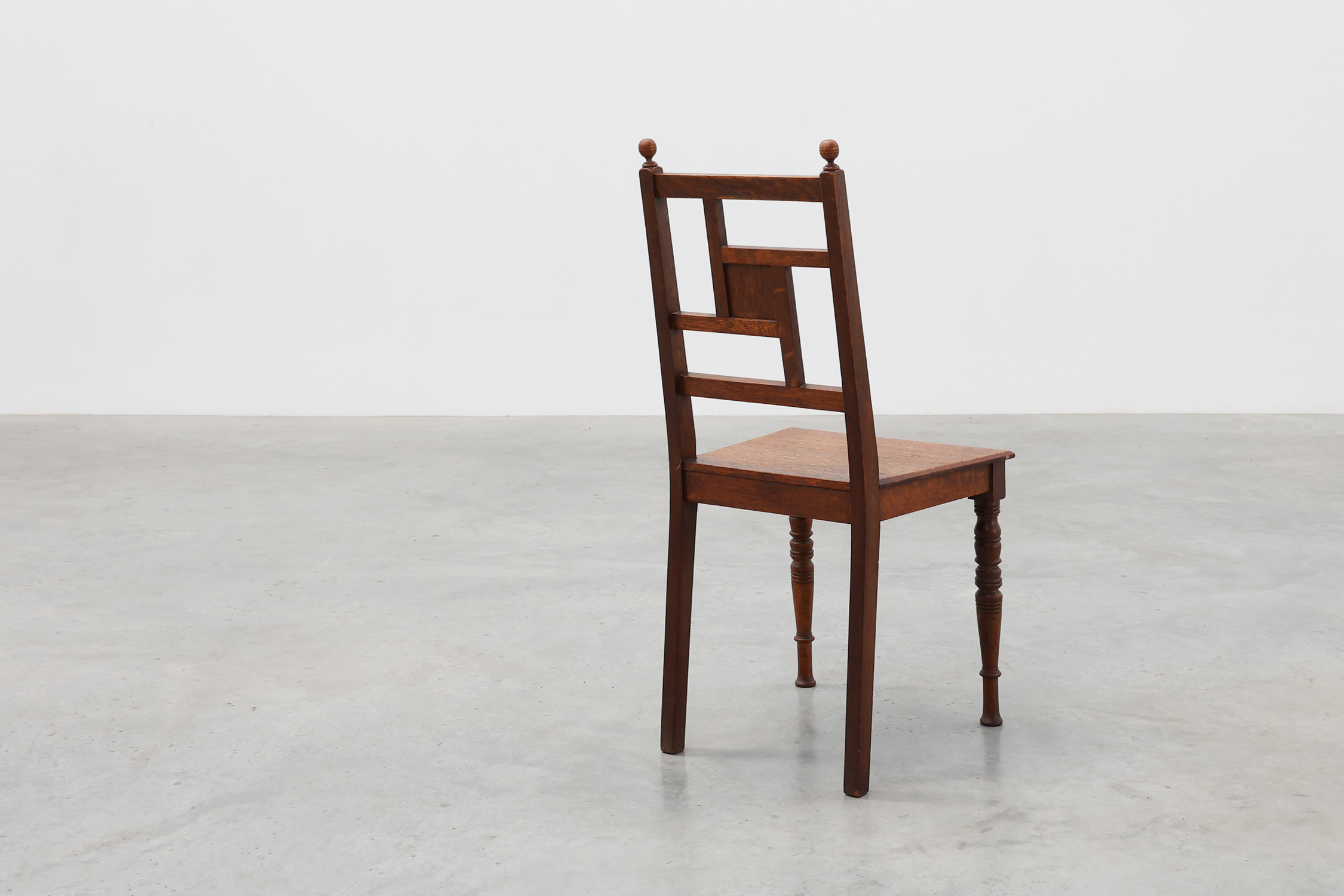 Art Deco oak side chair with carved rosette back and turned front legs, Belgium ca. 1915thumbnail